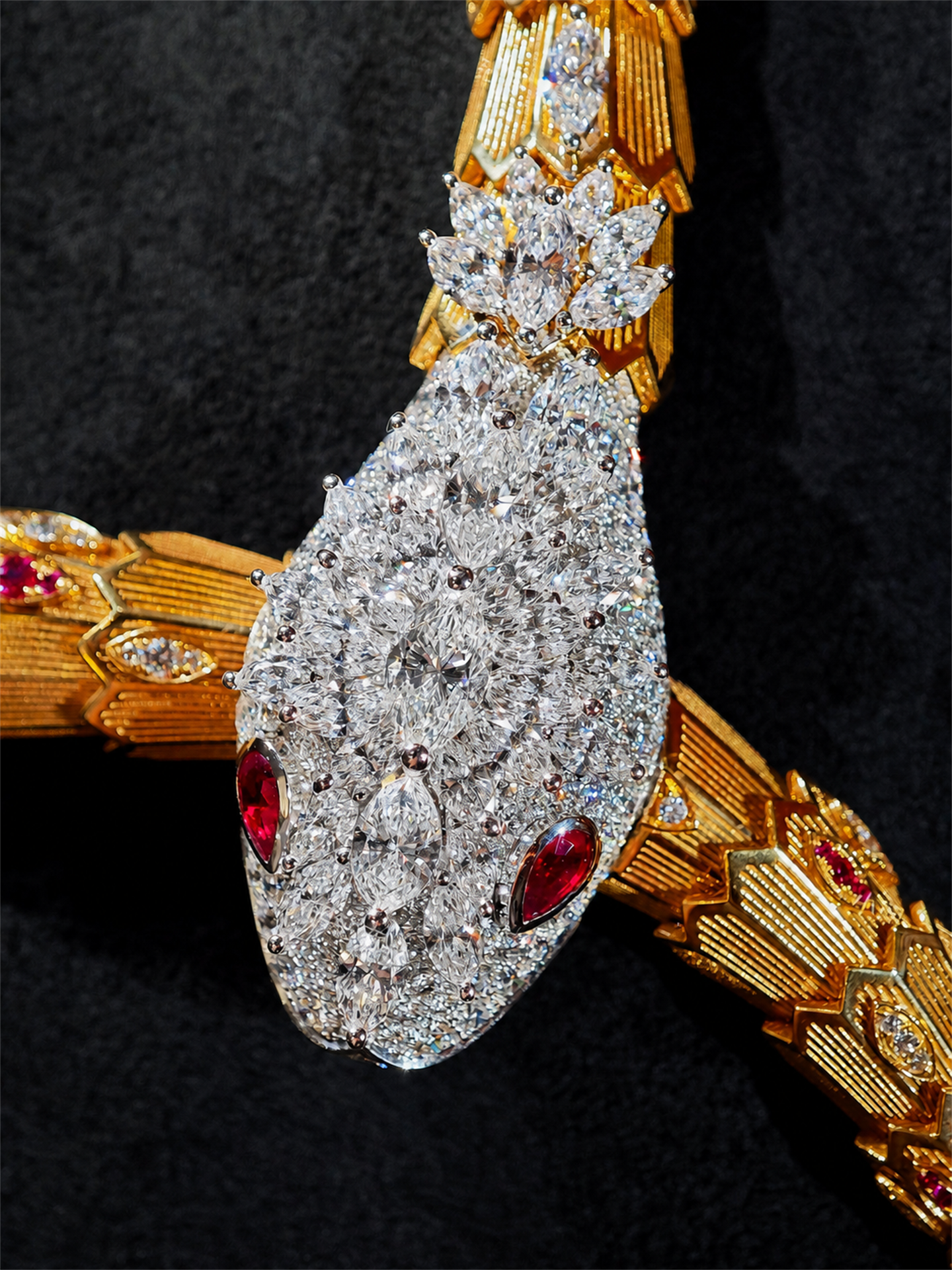 BVLGARI Serpenti high jewelry ruby and diamond lariat necklace, additional serpent head detail