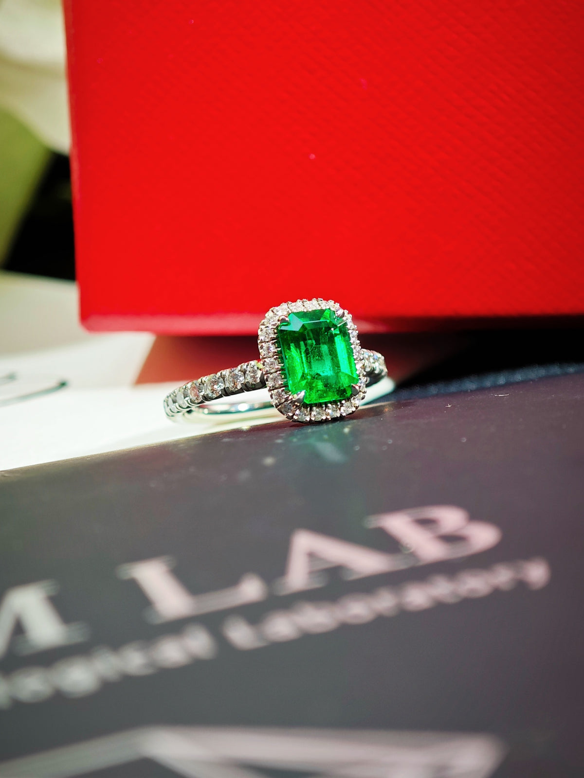 Cartier Destinée emerald solitaire ring with diamond halo