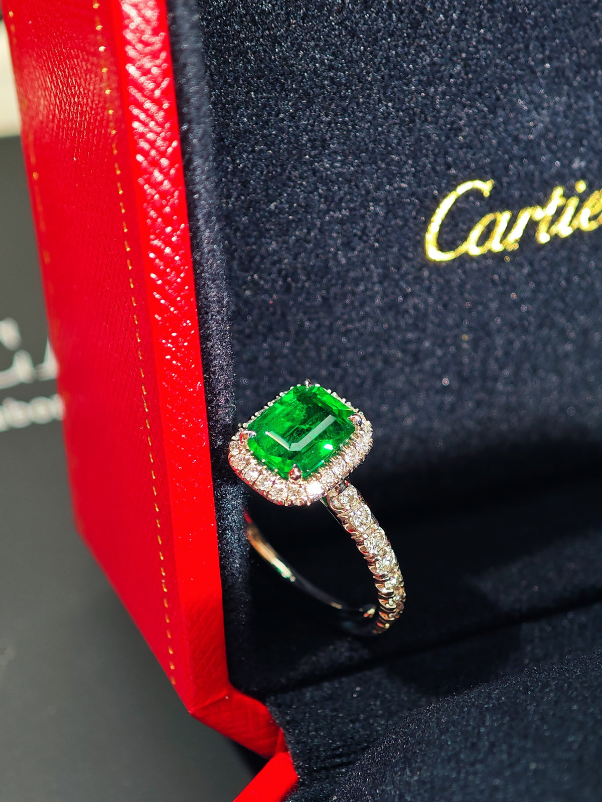 Cartier Destinée emerald solitaire ring with pavé diamond shoulders