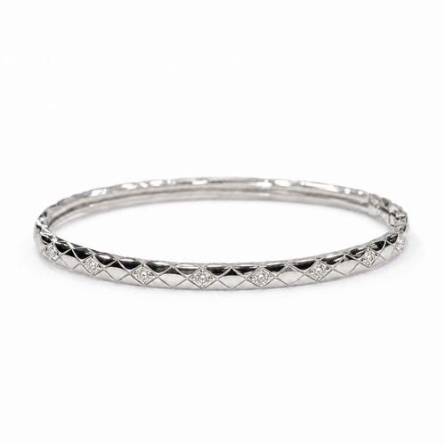 CHANEL COCO CRUSH mini diamond bracelet in 18K white gold on a neutral white background