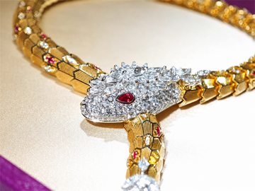 BVLGARI Serpenti high jewelry ruby and diamond lariat necklace, serpent head detail