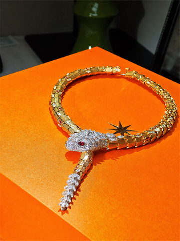 BVLGARI Serpenti high jewelry ruby and diamond lariat necklace, complete view on orange case
