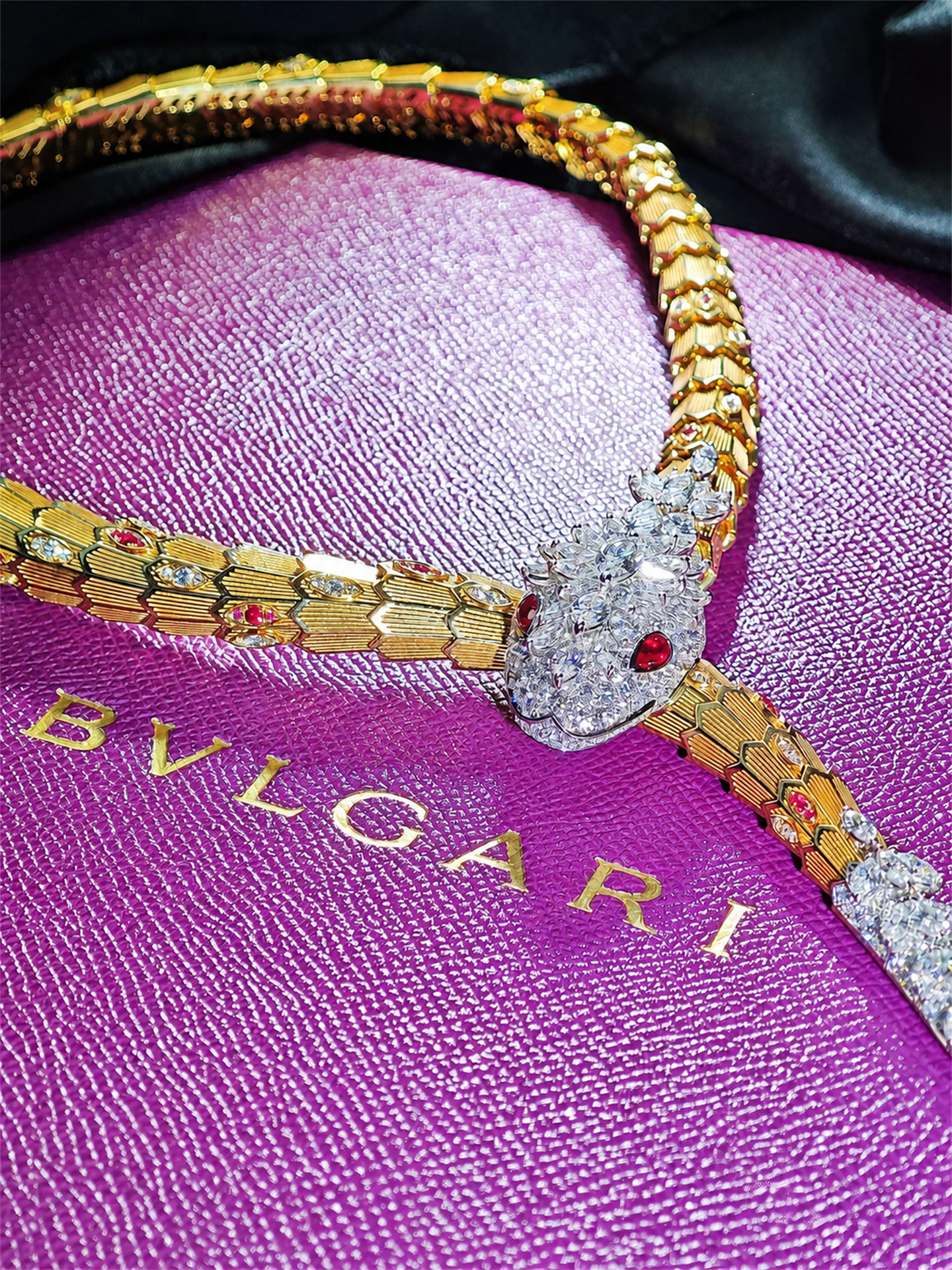 BVLGARI Serpenti high jewelry ruby and diamond lariat necklace, serpent head and scale detail