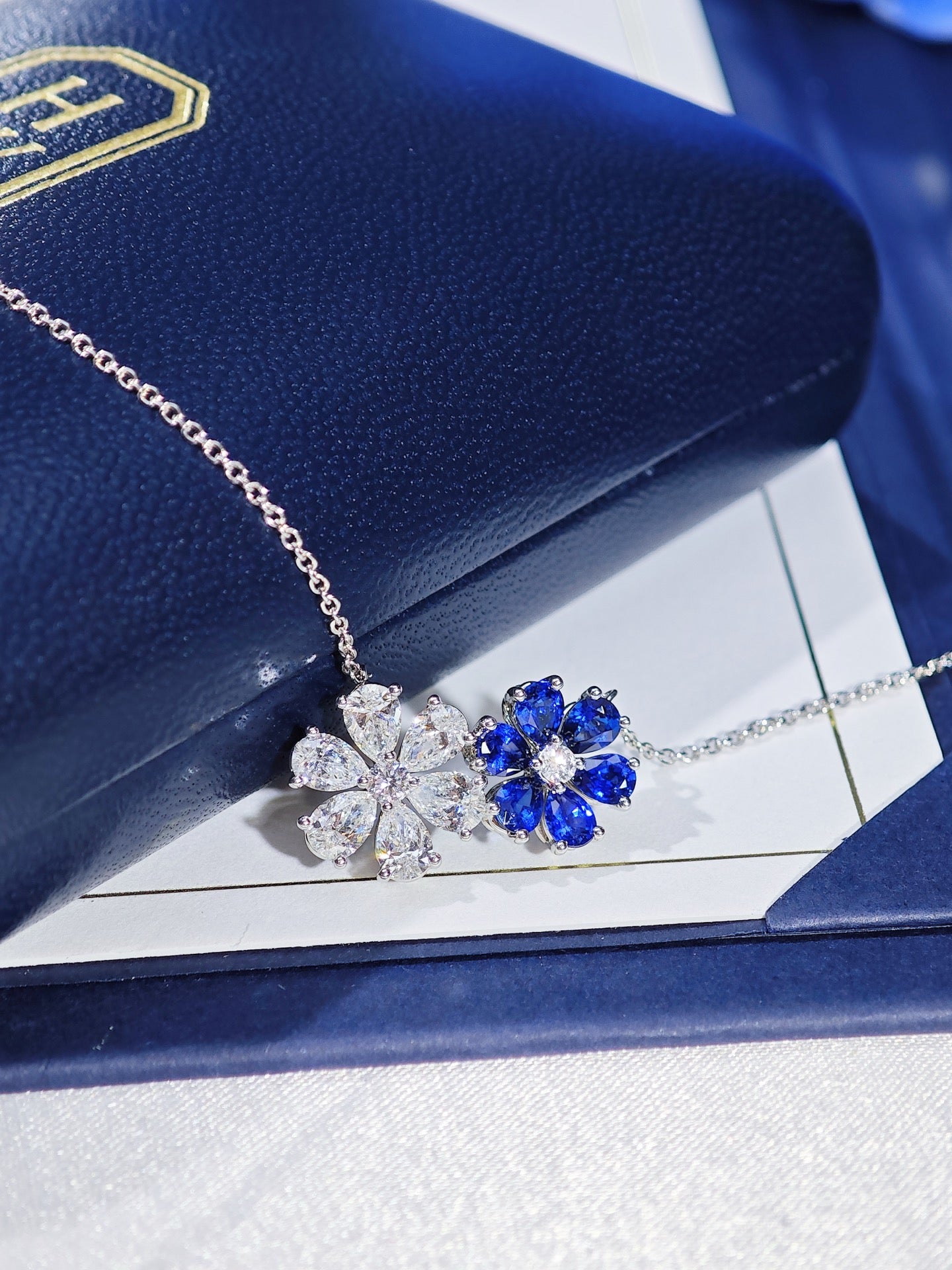 Harry Winston Forget-Me-Not sapphire and diamond twin pendant necklace detail