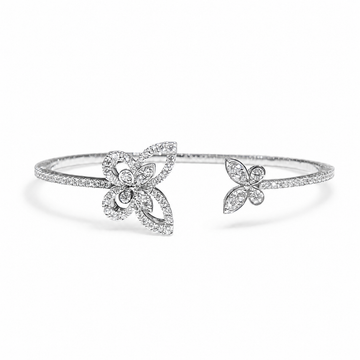GRAFF Butterfly Silhouette open diamond bangle in 18K white gold on a neutral white background
