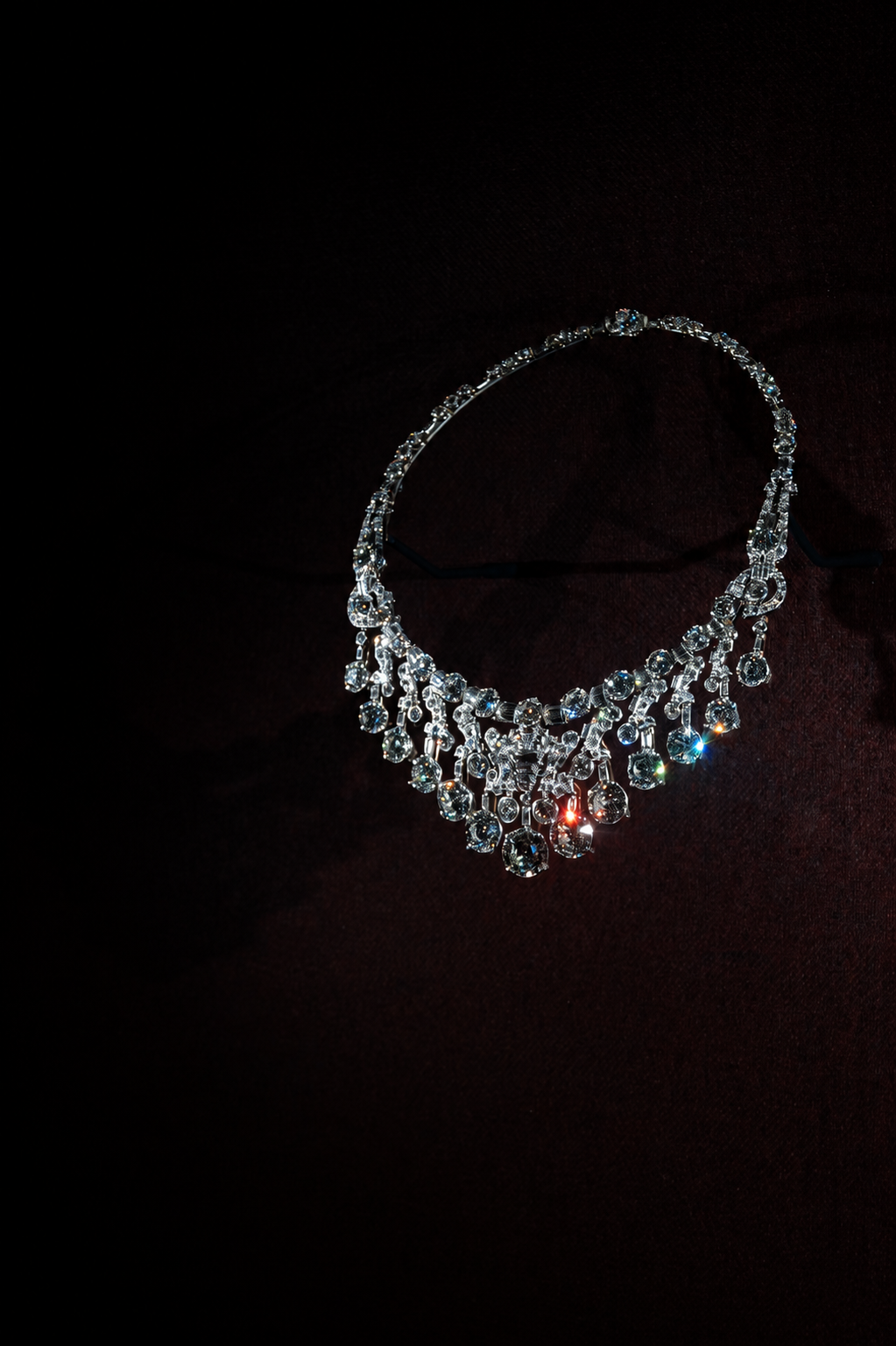 Diamond necklace on a dark editorial backdrop in The Vault